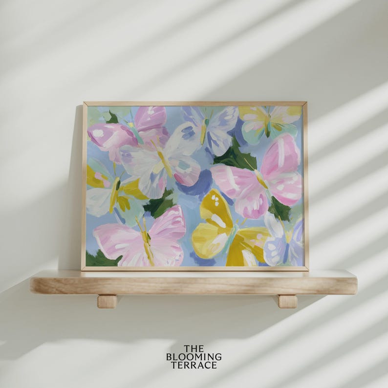 Colorful pastel butterflies in pink, yellow, lavender, and white with painterly brushstrokes on a light blue background. Whimsical digital download wall art, perfect for nursery, girls bedroom, or springtime decor.