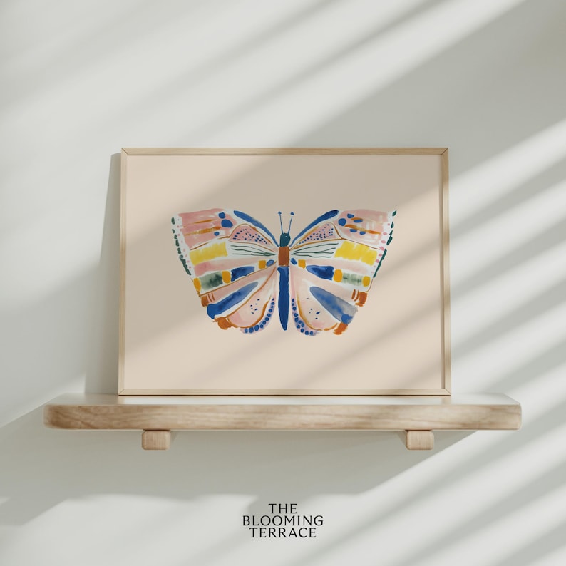 Hand-painted butterfly with bold brushstrokes in orange, pink, blue, and yellow on a soft peach background. Colorful whimsical digital wall art, perfect for nursery, kids’ bedroom, or playful spring decor.