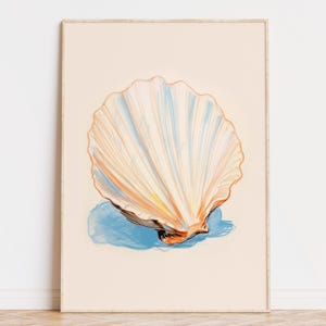 Puede incluir: Una gran concha blanca con un interior azul y naranja, pintada de forma estilizada. La concha descansa sobre un fondo azul.