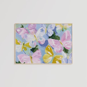 Colorful pastel butterflies in pink, yellow, lavender, and white with painterly brushstrokes on a light blue background. Whimsical digital download wall art, perfect for nursery, girls bedroom, or springtime decor.