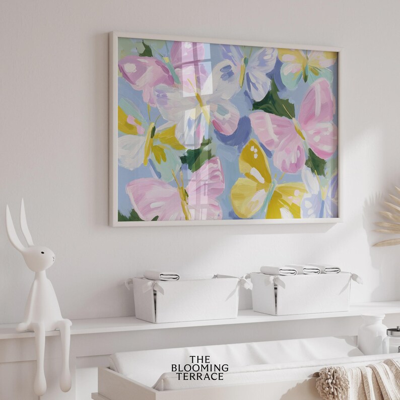 Colorful pastel butterflies in pink, yellow, lavender, and white with painterly brushstrokes on a light blue background. Whimsical digital download wall art, perfect for nursery, girls bedroom, or springtime decor.