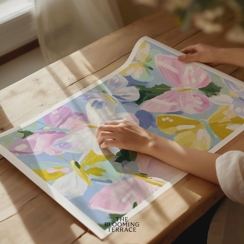 Colorful pastel butterflies in pink, yellow, lavender, and white with painterly brushstrokes on a light blue background. Whimsical digital download wall art, perfect for nursery, girls bedroom, or springtime decor.