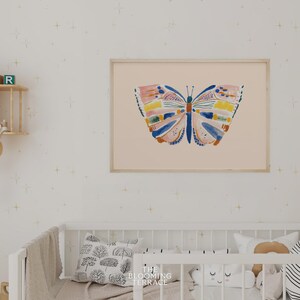 Hand-painted butterfly with bold brushstrokes in orange, pink, blue, and yellow on a soft peach background. Colorful whimsical digital wall art, perfect for nursery, kids’ bedroom, or playful spring decor.
