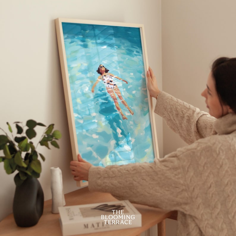 Painting of a woman in a white swimsuit and sunglasses floating on her back in turquoise pastel water under the summer sun.