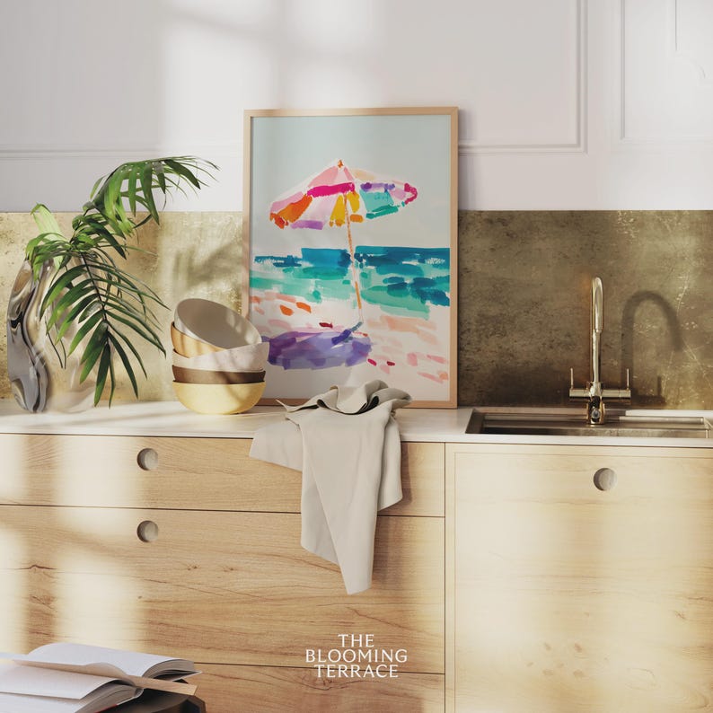 Bright watercolor-style painting of a colorful beach umbrella by the ocean — vibrant coastal wall art printable for summer home decor.