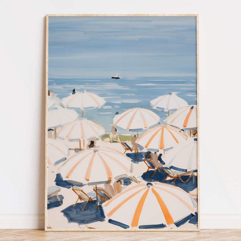 Beach scene featuring striped umbrellas and sunbathers by the calm ocean, painted in soft blue, peach, and cream tones — printable coastal wall art.