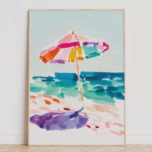 Bright watercolor-style painting of a colorful beach umbrella by the ocean — vibrant coastal wall art printable for summer home decor.