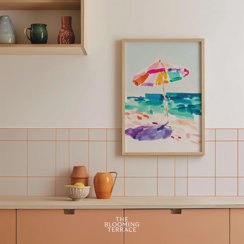 Bright watercolor-style painting of a colorful beach umbrella by the ocean — vibrant coastal wall art printable for summer home decor.