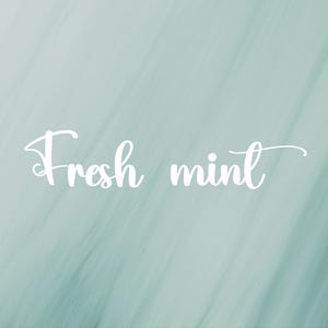 May include: A light mint green background with a soft, diagonal brushstroke texture. Centered in the middle of the image is the text "Fresh mint" written in a white, cursive, flowing script font that stands out against the pale green backdrop.