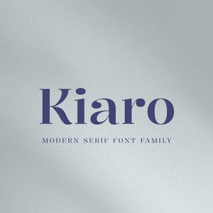 May include: A digital graphic featuring the word "Kiaro" in a dark blue serif font. Below the word is the text "MODERN SERIF FONT FAMILY" in a smaller, lighter blue font. The background is a light gray textured surface.