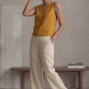 May include: A set of three ceramic nesting bowls in shades of blue, green, and white. The bowls feature a speckled glaze and a simple, modern design. The largest bowl measures approximately 8 inches in diameter.