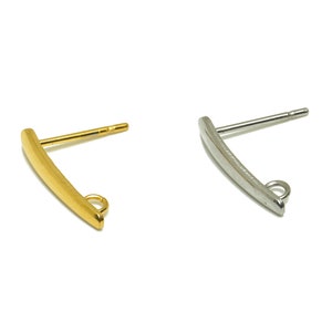 May include: Two earring findings, one gold and one silver, with a curved bar and a jump ring.