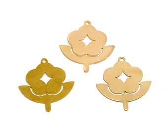 May include: Three gold-colored metal charms in a floral design. Each charm features a flower-like top with a diamond-shaped cutout and a curved base. The charms have a small loop at the top for attaching to jewelry.