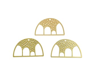 May include: Three gold metal arch-shaped charms with a dotted pattern. Each charm has three arches and a hole at the top.