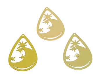 May include: Three gold-colored metal charms shaped like teardrops with a crescent moon and stars cut out.