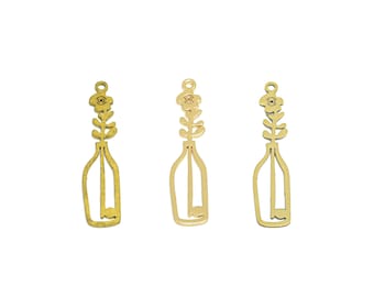 May include: Three gold metal flower vase charms with a simple line drawing of a flower and vase. The charms are approximately 2 inches in length.