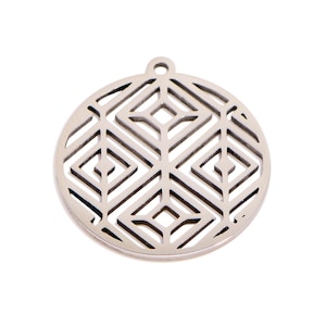 May include: A silver-colored, circular pendant with a geometric openwork design. The pendant features a series of diamond and rectangular shapes cut out of the metal, creating a decorative pattern. It has a small loop at the top for hanging.