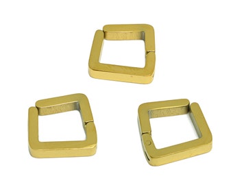 May include: Three gold-coloured metal square-shaped hoop earrings. Each earring is made of two pieces that connect to form a square shape.