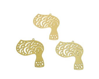 May include: Three gold-colored metal charms in the shape of a stylized person with a wavy hair design. Each charm has a hole at the top for attaching to a necklace or bracelet.