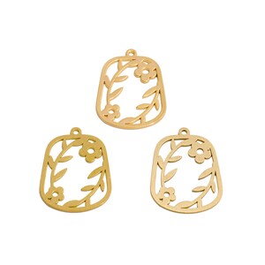 May include: Three gold-colored metal pendants with a floral design. Each pendant has a rectangular shape with rounded corners and a small loop at the top for hanging. The floral design includes flowers and leaves.