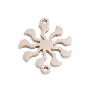 May include: Silver-toned metal charm with a sunburst design. The charm has a circular shape with multiple rays extending outwards. The rays are shaped like teardrops and have a smooth, polished finish. The charm has two small holes at the top for attaching to a necklace or bracelet.
