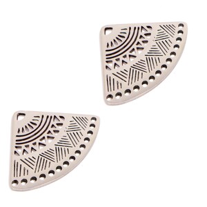 May include: Two off-white, semi-circular pendants with intricate black geometric patterns. Each pendant has a series of small holes along the curved edge and a single hole at the top for hanging. The design features lines, triangles, and semi-circles.