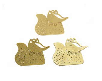 May include: Three gold metal fox charms with a dotted pattern. The foxes are in a sitting position with their tails curled behind them.