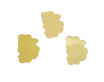 May include: Three gold-colored metal charms shaped like irregular clouds. Each charm has a small hole at the top for attaching to a necklace or bracelet.