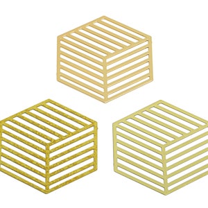 May include: Three gold-colored metal hexagonal shapes with a striped pattern. The shapes are stacked on top of each other.