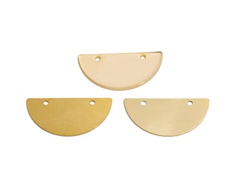 May include: Three gold-colored metal half-circle shapes with two holes each. The half-circles are slightly different sizes.