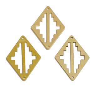 May include: Three gold metal diamond-shaped charms with a geometric design. Each charm has a hole at the top for attaching to a necklace or bracelet.
