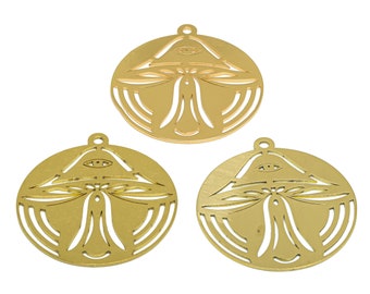 May include: Three gold-coloured metal charms in the shape of a mushroom with an eye in the centre. Each charm has a hole at the top for hanging.