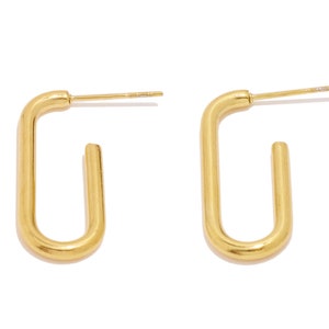 May include: A pair of gold-toned hoop earrings with a rectangular shape.