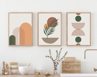 May include: Three framed abstract art prints. Each print features a minimalist design with earthy tones of orange, green, and brown. The art includes geometric shapes and botanical elements, creating a modern, stylish aesthetic.