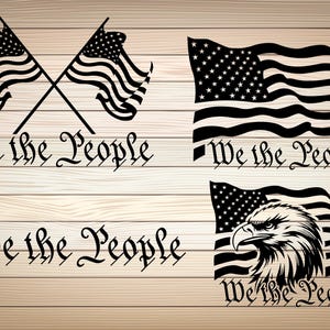 May include: Black and white graphic design featuring three variations of the American flag with the text "We the People" written below each flag. The flags are displayed on a woodgrain background.