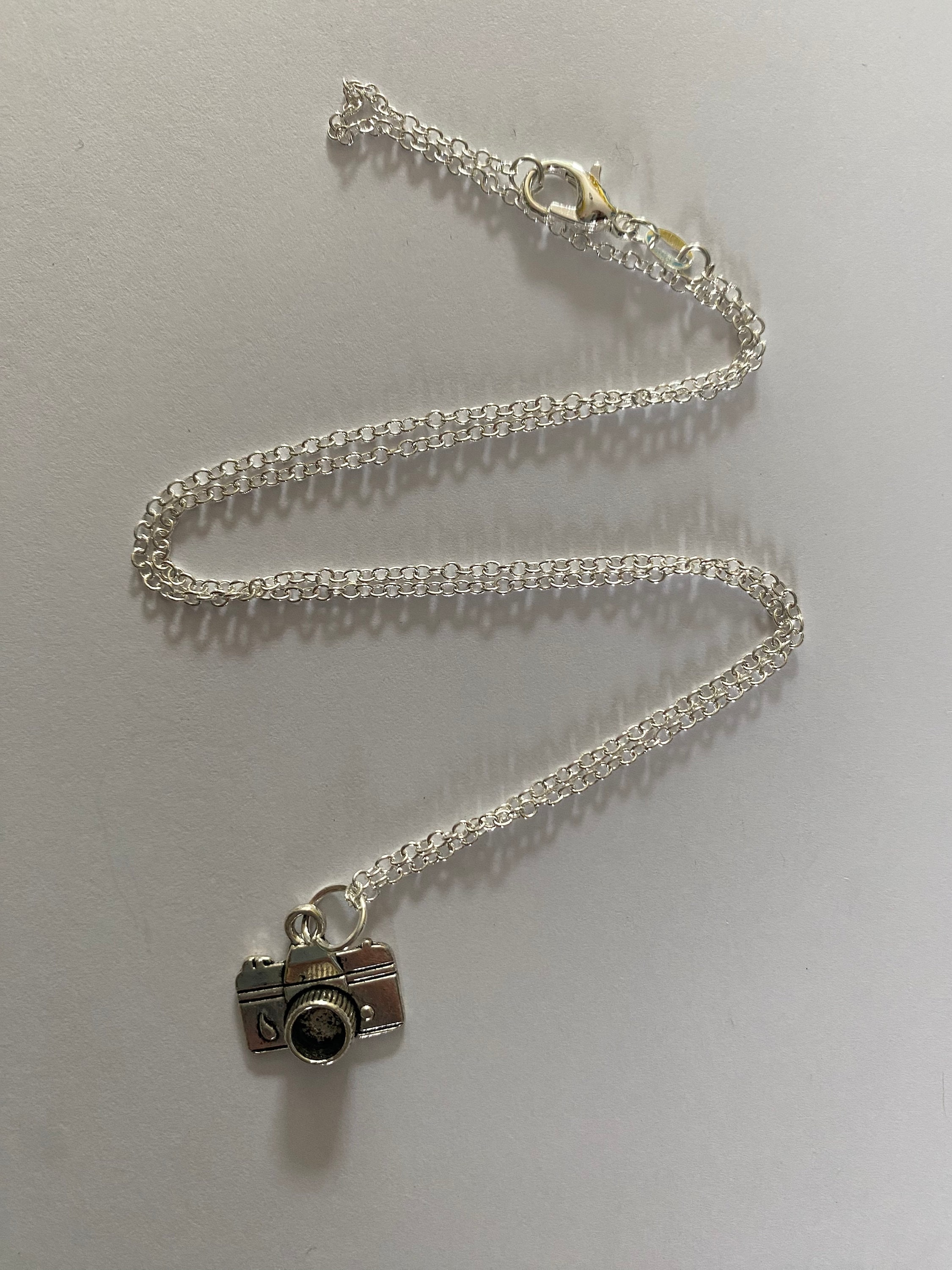 Spy camera cross necklace sales