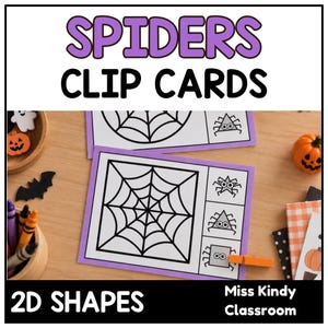 Könnte beinhalten: Spiders Clip Cards 2D Shapes Miss Kindy Classroom Lernkarten mit schwarz-weißen Spinnennetz-Illustrationen und geometrischen Spinnenformen auf violetten Rändern mit einer orangefarbenen Klammer an einer quadratischen Spinnenkarte.