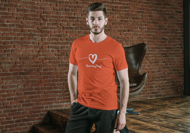 May include: A red t-shirt with a white heart and the text "Happy Every Day!" printed on the front.