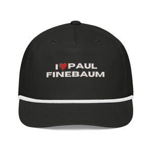 May include: Black baseball cap with a white rope detail and a curved brim. The cap features the embroidered text "I ❤️ PAUL FINEBAUM" in white with a red heart symbol.