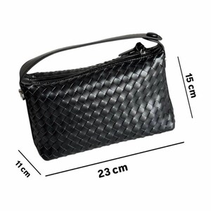 May include: Black woven handbag with a handle. The bag is rectangular, measuring 9 inches long, 6 inches high, and 4 inches wide. The bag has a zipper closure and a single handle.