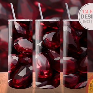 May include: Three stainless steel tumblers with a red gemstone design. The tumblers are on a wooden surface. 12 FREE DESIGNS INCLUDED. PART OF THE BUNDLE LINK IN THE DESCRIPTION.