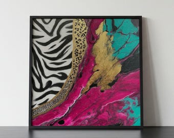 May include: A square framed wall art piece featuring a split design. The left side displays a black and white zebra stripe pattern, separated by a gold leopard print border from an abstract fluid pour section in vibrant magenta, teal, and gold.