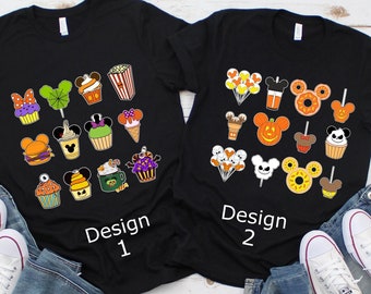 May include: Two black t-shirts with different designs featuring Mickey Mouse and Halloween themed food and treats. The text "Design 1" and "Design 2" is printed on the shirts.