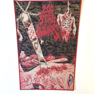 May include: A red and black woven patch featuring the text "Slave to the Scalpel" and a graphic of a bloody human body with a scalpel piercing through it.
