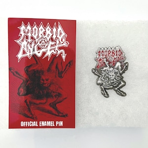 May include: A silver metal pin featuring a black and white illustration of a demon with the words "Morbid Angel" in red and white lettering. The pin is on a white background with a red backing card that says "Official Enamel Pin".