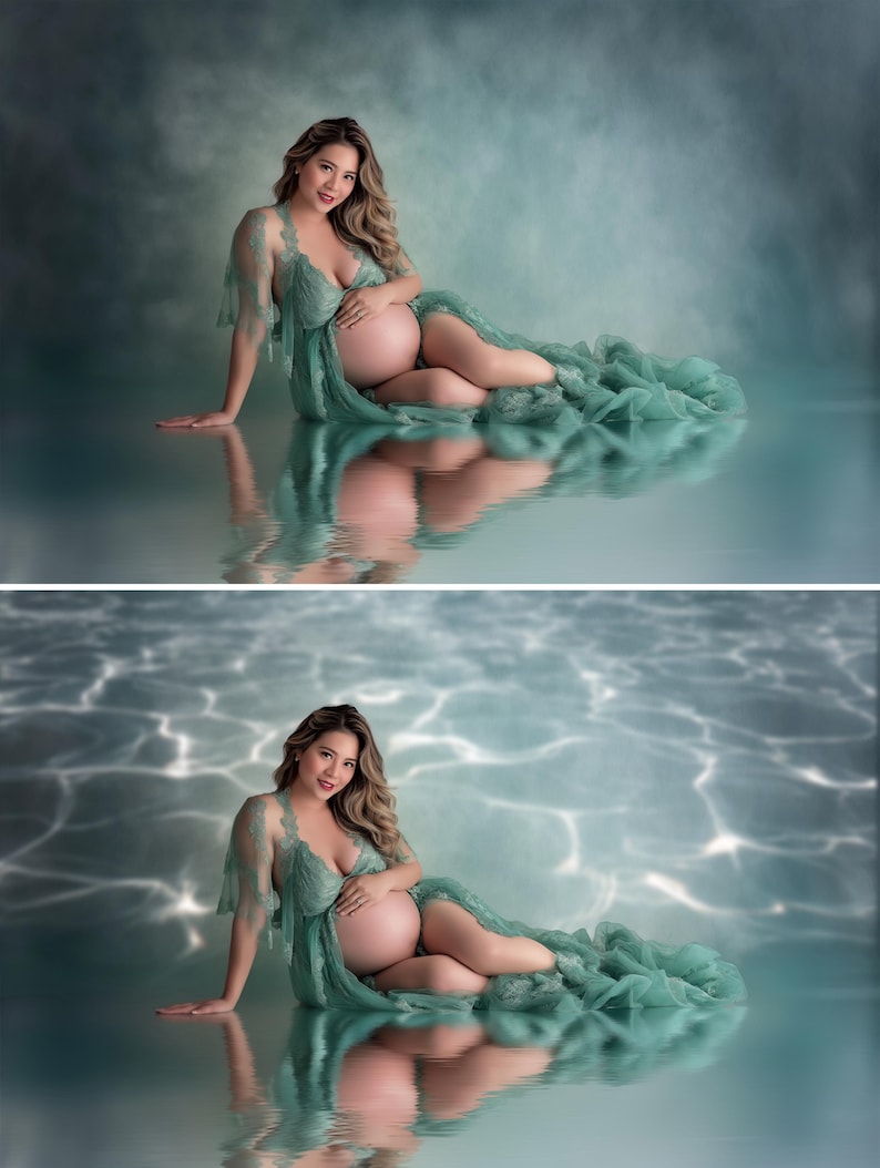 May include: A pregnant person wearing a flowing, sage green maternity gown. The gown features delicate lace detailing on the sleeves and bodice. The person is seated on a reflective surface, with a soft, blue-green background.