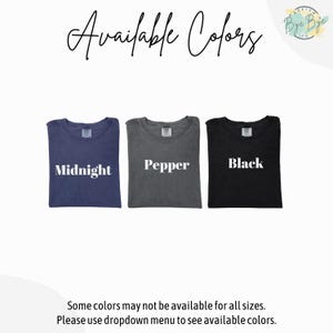 May include: Three t-shirts displayed in a row with the text Available Colors at the top. The shirts are labeled Midnight, Pepper, and Black. The text at the bottom reads Some colors may not be available for all sizes. Please use dropdown menu.