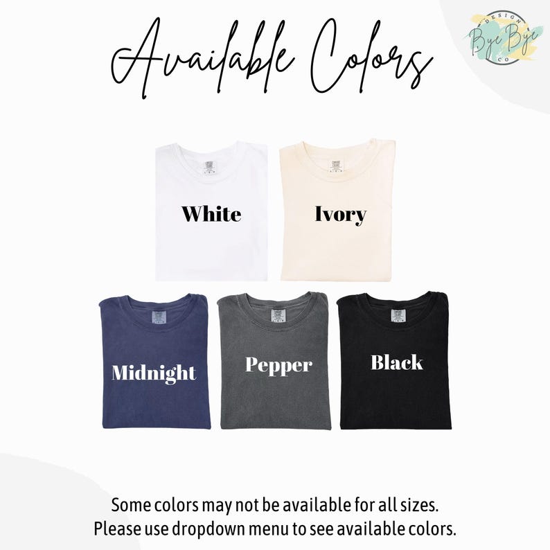 May include: A display of t-shirts in various colors: white, ivory, midnight blue, pepper gray, and black. The text "Available Colors" is at the top, with the color names printed on each shirt. The bottom text reads "Some colors may not be available for all sizes."