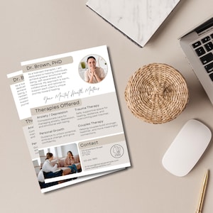 May include: A business card for a therapist, Dr. Brown, PHD. The card features a photo of Dr. Brown, a list of therapies offered, including anxiety/depression, trauma therapy, couples therapy, and personal growth, and contact information. The card has a light brown background with white text.