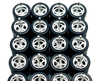May include: Set of 18 chrome electroplated Crager wheels for 1/64 scale model cars. The wheels are 13mm in diameter and have a black tire.